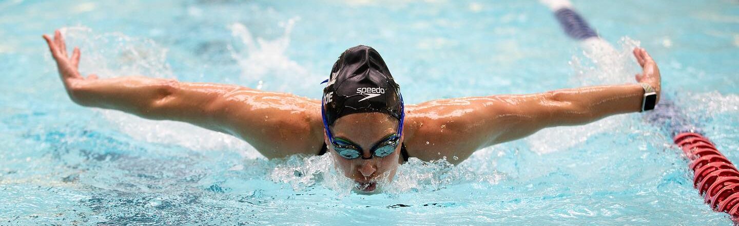 Dame Sophie Pascoe Swimming in a pool with arms out wide